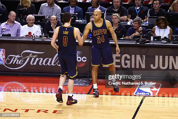 Kevin Love and Richard Jefferson of the Cleveland Cavaliers shake hands during Game Six of the NBA Eastern Conference Finals against the Toronto...