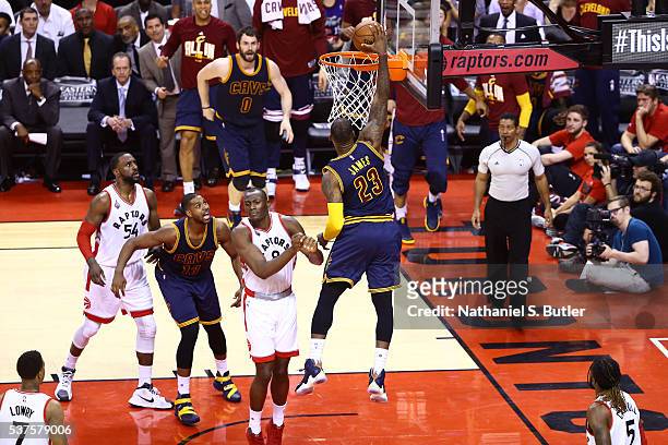 LeBron James of the Cleveland Cavaliers dunks the ball against the Toronto Raptors during Game Six of the NBA Eastern Conference Finals at Air Canada...