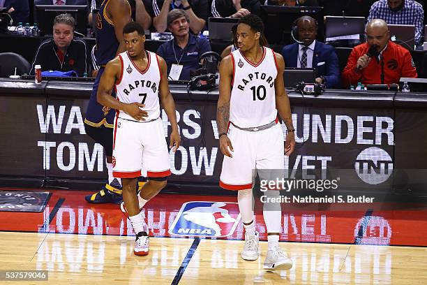 Kyle Lowry and DeMar DeRozan of the Toronto Raptors walk on the court during Game Six of the NBA Eastern Conference Finals against the Cleveland...