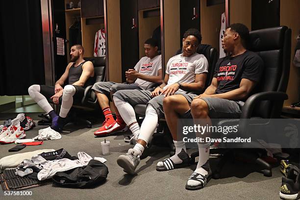 Jonas Valanciunas, Bruno Caboclo, DeMar DeRozan and Kyle Lowry of the Toronto Raptors sit by their lockers before Game Six of the NBA Eastern...