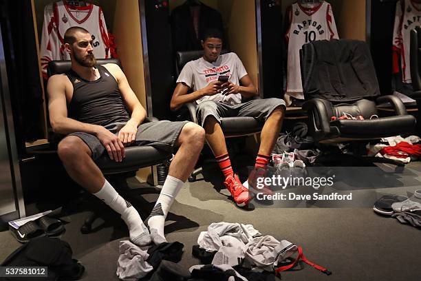 Jonas Valanciunas and Bruno Caboclo of the Toronto Raptors sit by their lockers before Game Six of the NBA Eastern Conference Finals against the...