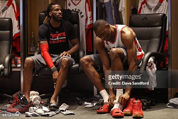 DeMarre Carroll and Bismack Biyombo of the Toronto Raptors get ready before Game Six of the NBA Eastern Conference Finals against the Cleveland...