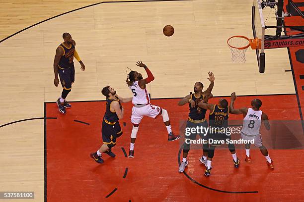 DeMarre Carroll of the Toronto Raptors drives to the basket and shoots the ball in Game Six of the NBA Eastern Conference Finals against the...