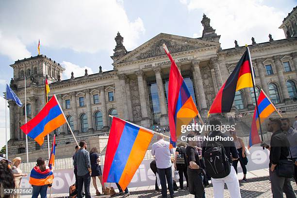 Activists protest outside the Reichstag building while the Bundestag is discussing a resolution regarding the recognition of the Armenian genocide on...