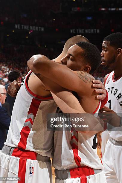 Jonas Valanciunas and Norman Powell of the Toronto Raptors hug after Game Six of the NBA Eastern Conference Finals against the Cleveland Cavaliers at...