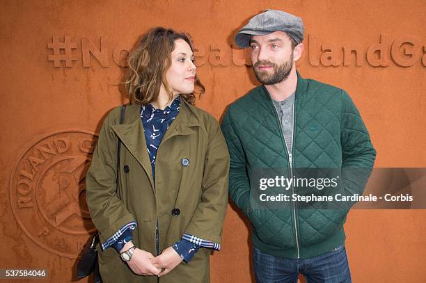 Actors Alysson Paradis and her companion Guillaume Gouix attend attends day twelve of the 2016 French Open at Roland Garros on June 2, 2016 in Paris,...