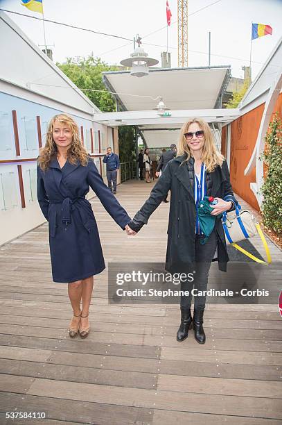 Actresses Julie Ferrier and Pascale Arbillot attend day twelve of the 2016 French Open at Roland Garros on June 2, 2016 in Paris, France.