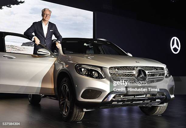 Roland S. Folger, Managing Director and CEO, Mercedes-Benz India, poses with the company’s GLC model during its launch on June 2, 2016 in New Delhi,...