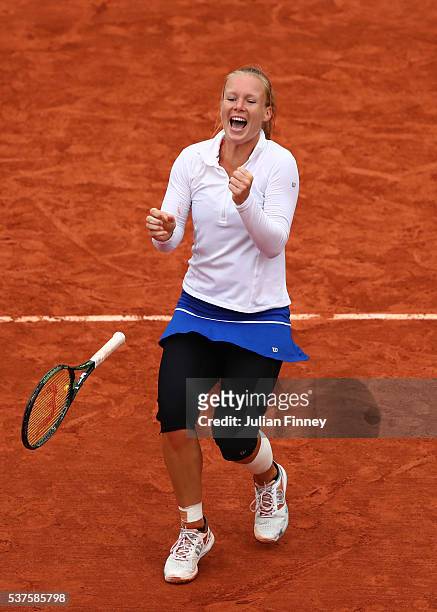Kiki Bertens of Netherlands celebrates victory during the Ladies Singles quarter final match against Timea Bacsinszky of Switzerland on day twelve of...