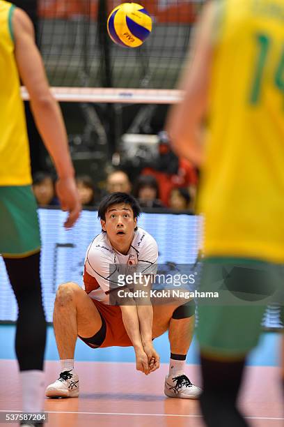 Yuta Yoneyama of Japan receives the ball during the Men's World Olympic Qualification game between Australia and Japan at Tokyo Metropolitan...