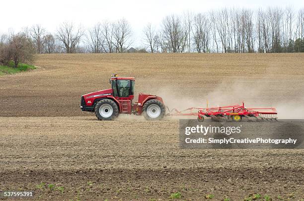 farmer cultivating in spring - international harvester stock pictures, royalty-free photos & images