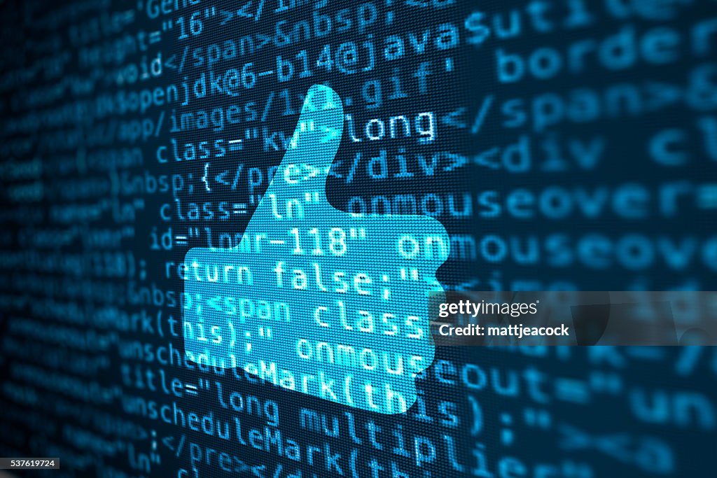 Computer data code screen with thumbs up icon