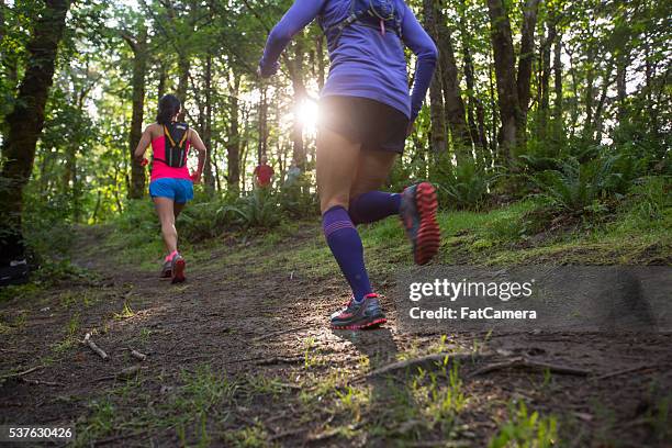 ultra marathon runners running outdoors in nature - ultra marathon stock pictures, royalty-free photos & images