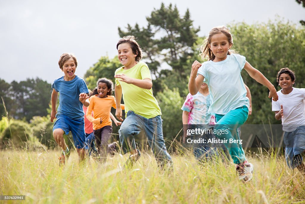 Children running together in a park