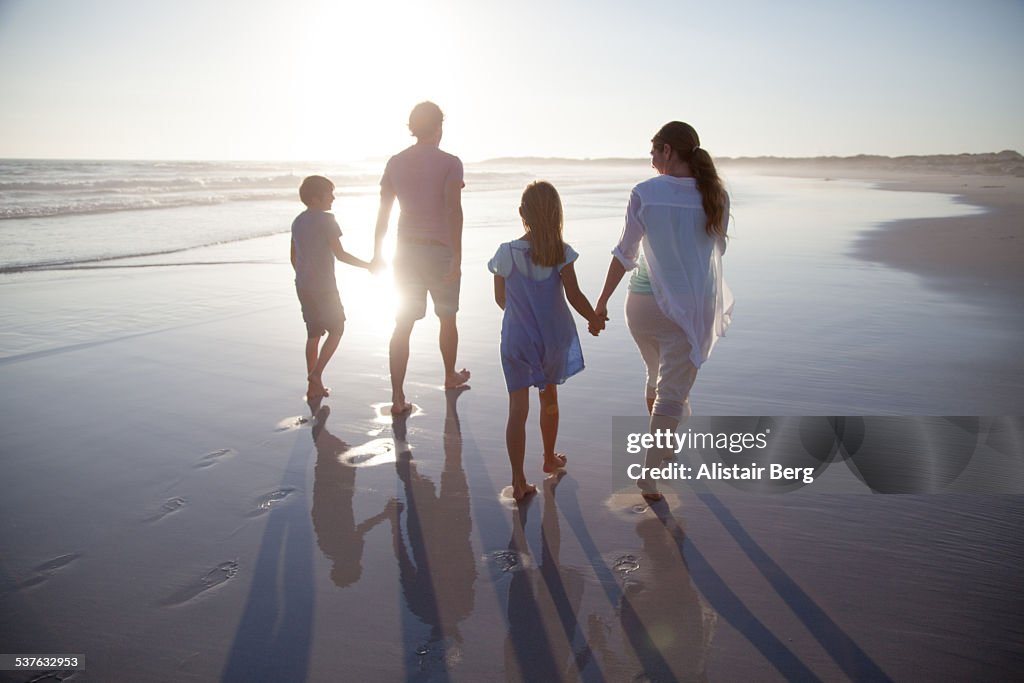 Family walking together on a beach