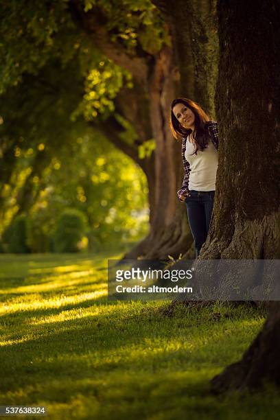 beautiful young women in a park - attraktive frau stock pictures, royalty-free photos & images