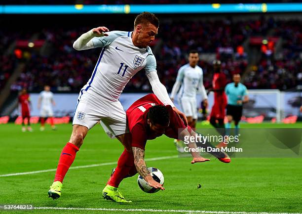Vieirinha of Portugal and Jamie Vardy of England battle for the ball during the international friendly match between England and Portugal at Wembley...