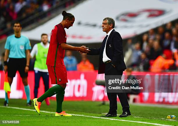 Bruno Alves of Portugal shakes hands with Fernando Santos manager of Portugal as he is sent off during the international friendly match between...