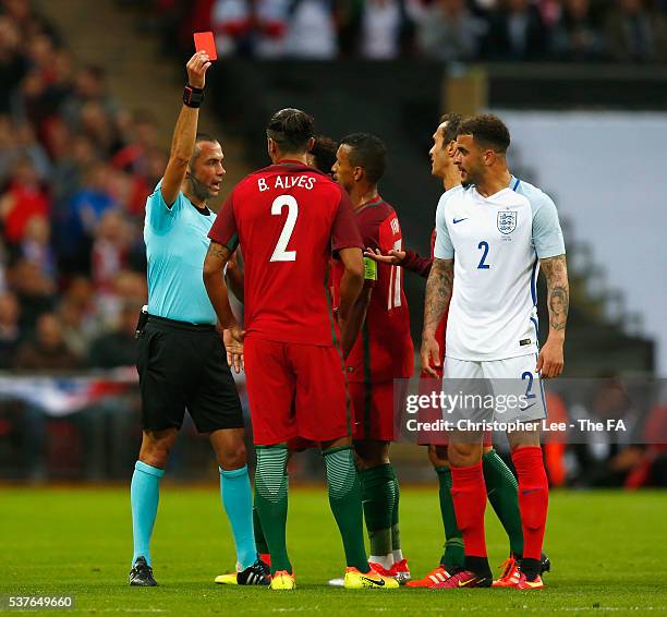 Referee Marco Guida shows the red card to Bruno Alves of Portugal after his challenge on Harry Kane of England during the International Friendly...