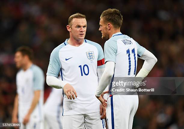 Wayne Rooney and Jamie Vardy of England speak during the international friendly match between England and Portugal at Wembley Stadium on June 2, 2016...
