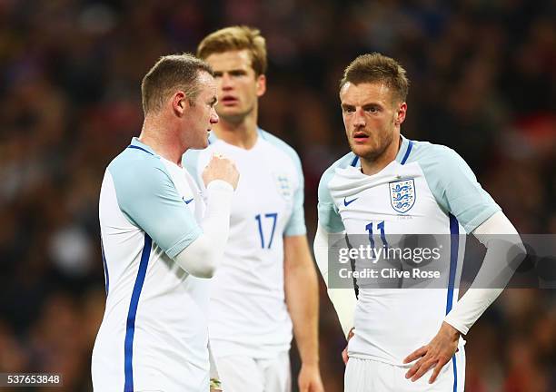 Wayne Rooney and Jamie Vardy of England speak during the international friendly match between England and Portugal at Wembley Stadium on June 2, 2016...