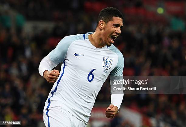 Chris Smalling of England celebrates as he scores their first goal during the international friendly match between England and Portugal at Wembley...