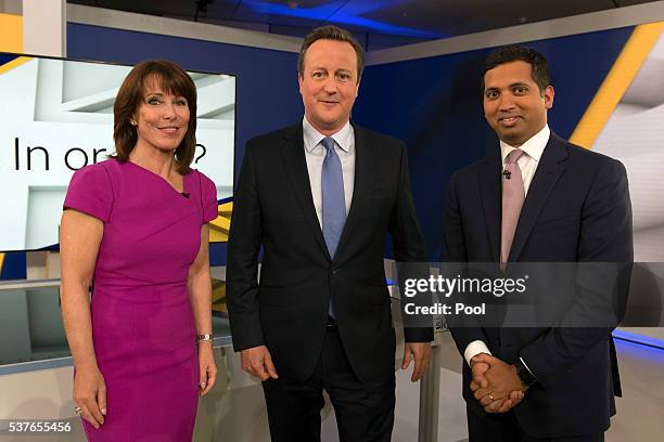 Prime Minister David Cameron poses for a photograph with Faisal Islam and Kay Burley after attending a Sky News interview and Q and A session where...