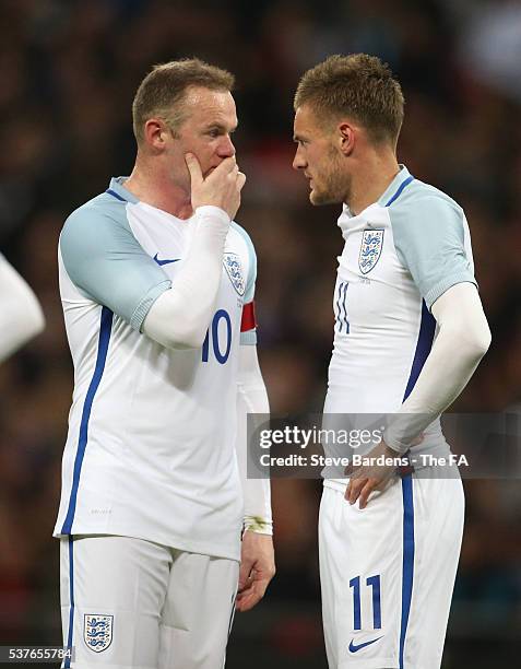 Wayne Rooney of England talks with Jamie Vardy of England during the International Friendly match between England and Portugal at Wembley Stadium on...