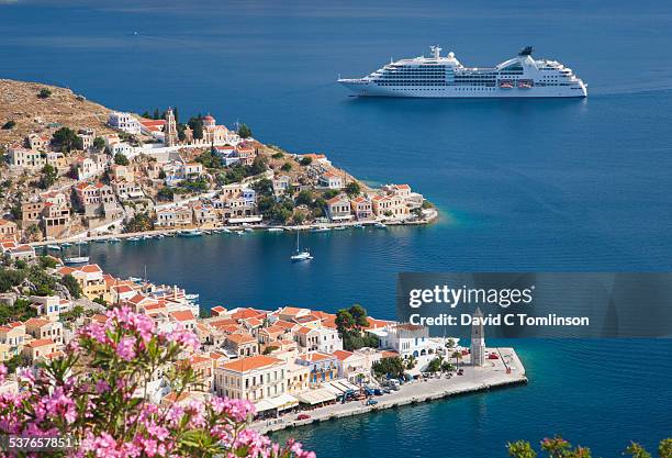 view over harani bay, gialos, symi, greece - kreuzfahrtschiff stock-fotos und bilder