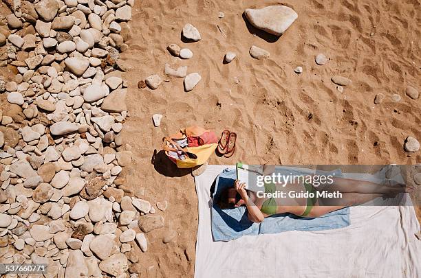 woman relaxing on beach - longeville sur mer stock pictures, royalty-free photos & images