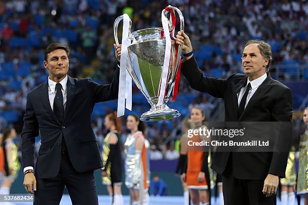 Javier Zanetti and Franco Baresi parade the trophy ahead of the UEFA Champions League Final between Real Madrid and Club Atletico de Madrid at Stadio...