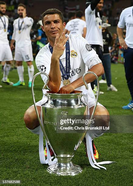 Cristiano Ronaldo of Real Madrid celebrates with the trophy following the UEFA Champions League Final between Real Madrid and Club Atletico de Madrid...