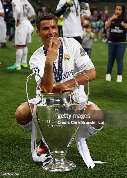 Cristiano Ronaldo of Real Madrid celebrates with the trophy following the UEFA Champions League Final between Real Madrid and Club Atletico de Madrid...