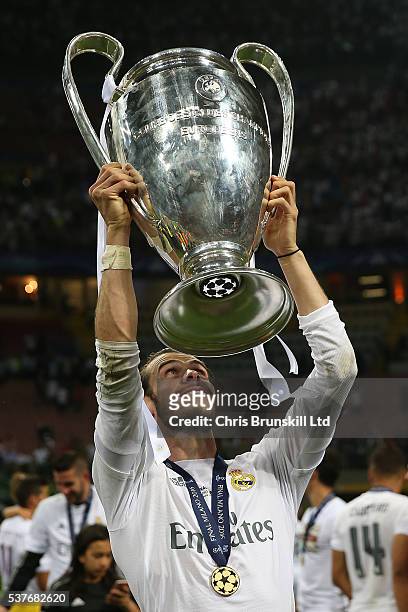 Gareth Bale of Real Madrid celebrates with the trophy following the UEFA Champions League Final between Real Madrid and Club Atletico de Madrid at...