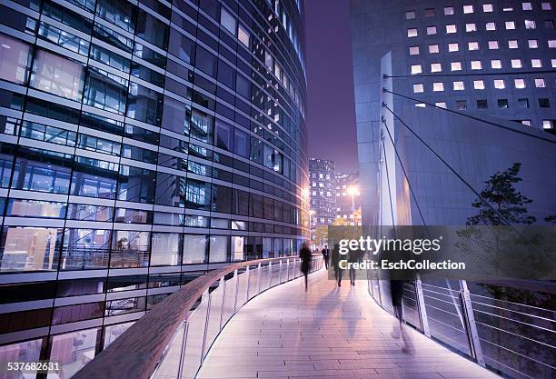 business people using walkway at business district - zona financiera fotografías e imágenes de stock