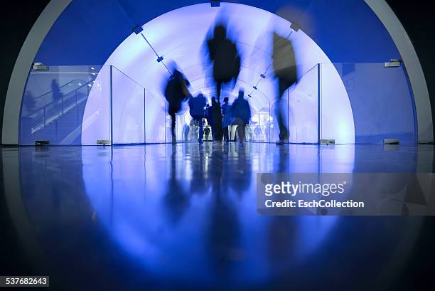 people passing led illuminated tunnel - tunnel stockfoto's en -beelden