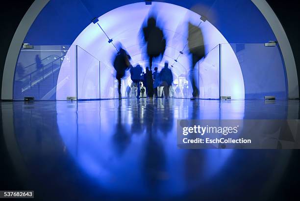 people passing led illuminated tunnel - light tunnel stock pictures, royalty-free photos & images