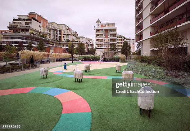 playground with large apartment buildings in paris - ile de france stock-fotos und bilder