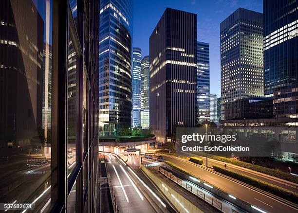 illuminated skyline of la defense in paris at dusk - france skyline stock pictures, royalty-free photos & images