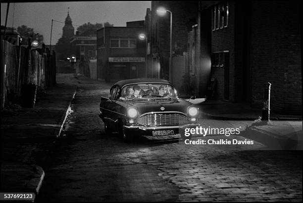 English ska revival band The Specials in a 1961 Vauxhall Cresta during the video shoot for their single 'Ghost Town' in the Kings Cross area of...