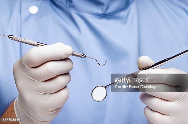 dentist doing dental examination - zahnarztausrüstung stock-fotos und bilder