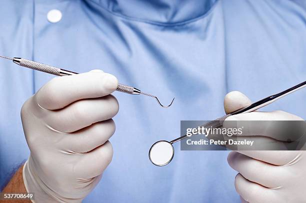 dentist doing dental examination - dentist photos et images de collection