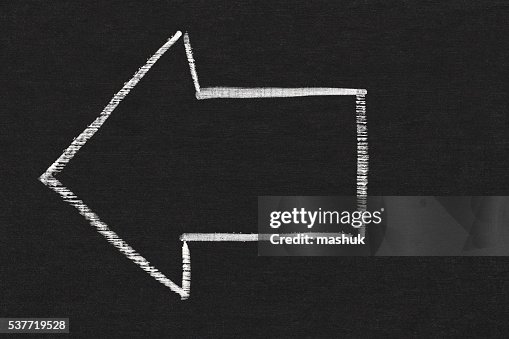 Backward arrow on chalkboard background Backward arrow on chalkboard background
