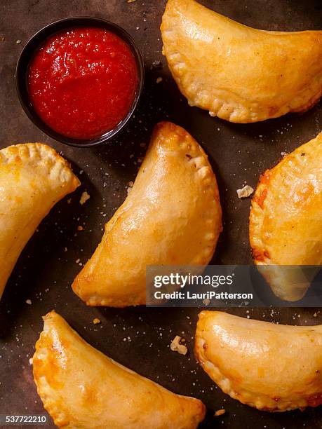 mini homemade calzones with marinara sauce - calzone stock pictures, royalty-free photos & images