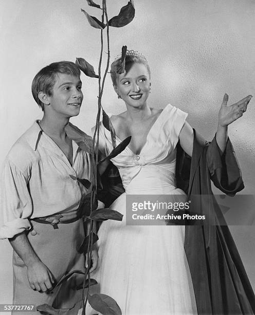 American actors Celeste Holm and Joel Grey as 'Jack' in stage costume for their roles in 'Jack and the Beanstalk', circa 1956.