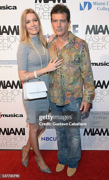Nicole Kimpel and Antonio Banderas attend the Fisico Fashion Show during Miami Fashion Week at Ice Palace on June 2, 2016 in Miami, Florida.