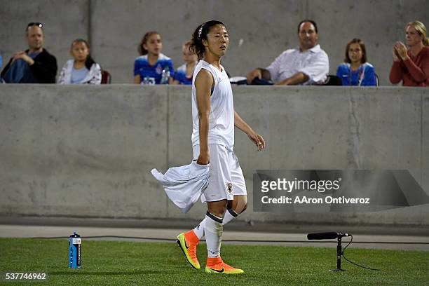 Yuki Ogimi of Japan reacts to receiving a red card as she walks off the pitch against the U.S. Women's National Team during the second half of their...