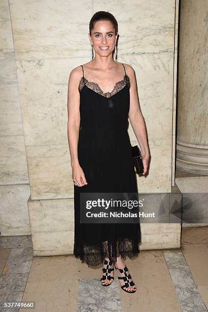 Amanda Peet attends the CHANEL Fine Jewelry Dinner supporting treasures from the New York Public Library Collection at the New York Public Library's...