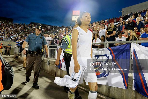 Yuki Ogimi of Japan walks off the pitch after being red carded against the U.S. Women's National Team during the second half of their 3-3 tie. The...