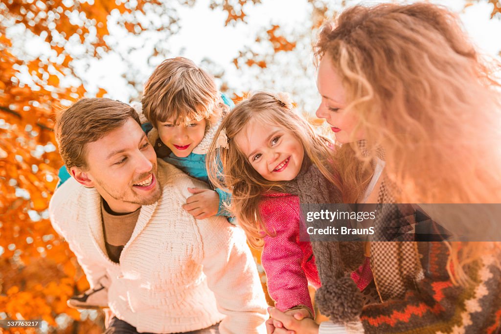 Young family in autumn.